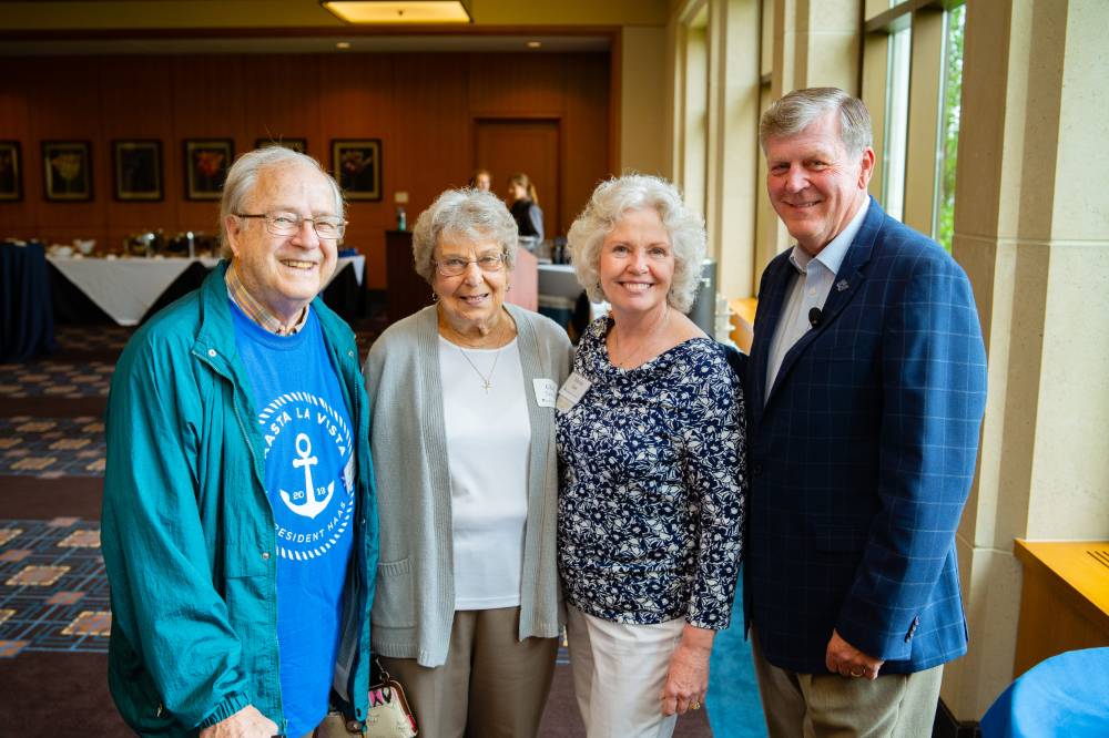President Tom and Marica Haas posing with guests at the Retiree Reception.